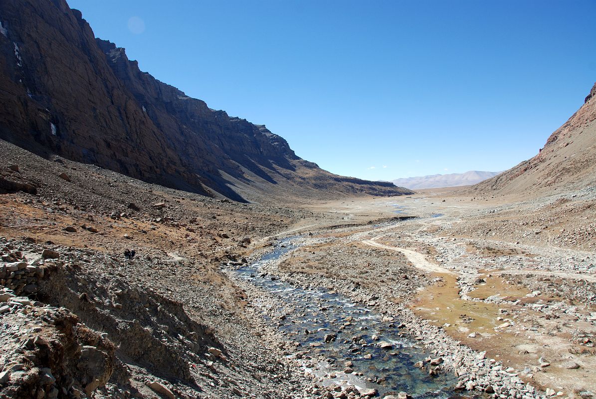 17 Looking Back At Lha Chu Valley From Past Chuku Nyenri Gompa On Mount Kailash Outer Kora From the Chuku (Nyenri) Gompa, it is a quick descent to the Lha Chu and the trail continues up the valley. Here is a view looking back toward the entrance to the Lha Chu Valley.